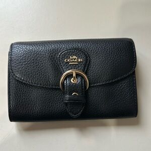 Small leather coach wallet.